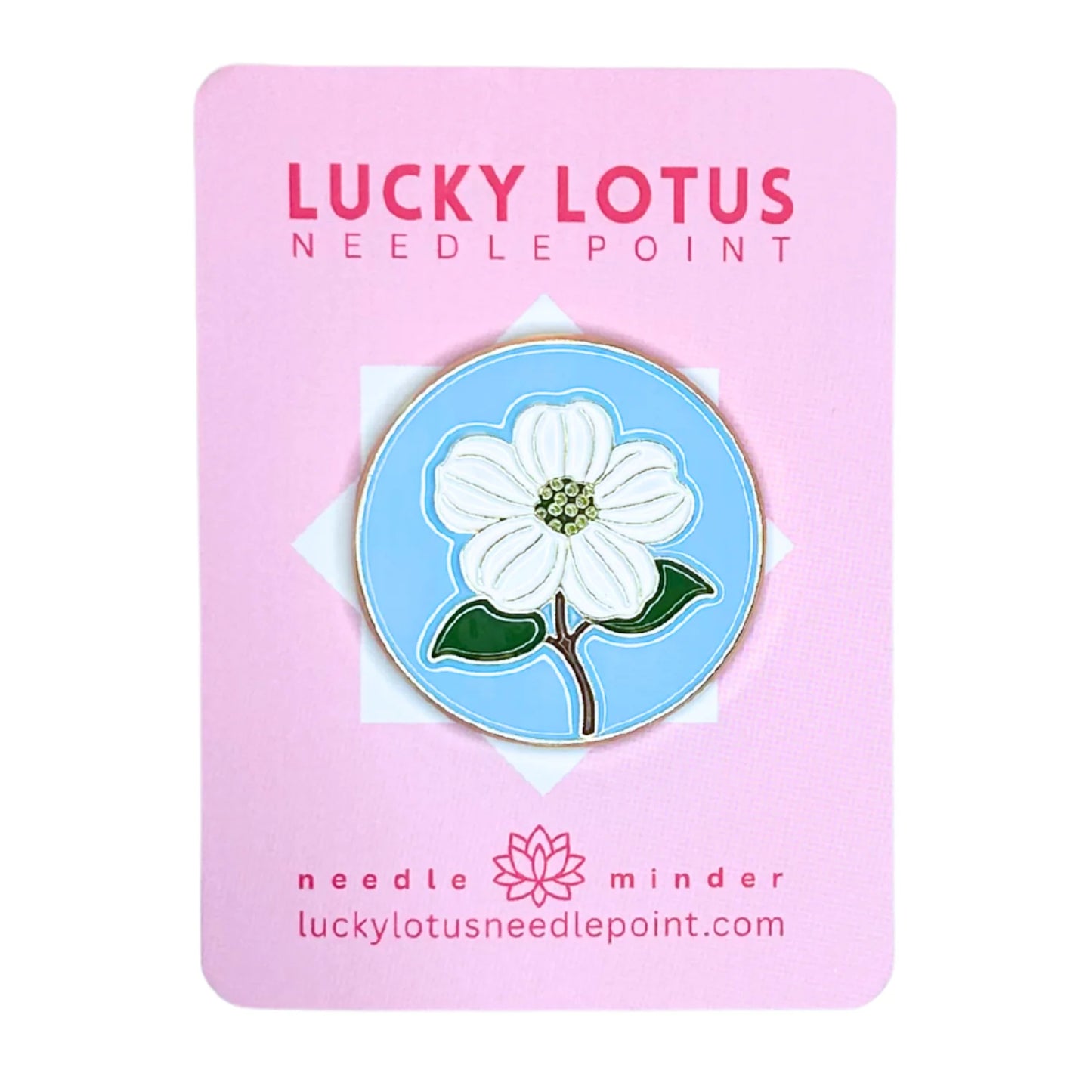 Floral pin on a pink card with 'Lucky Lotus Needle Point' branding