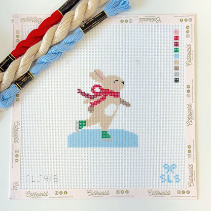 Ice skating bunny needlepoint canvas on 13 mesh with red scarf and coordinating threads