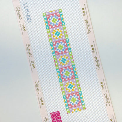Close-up of pastel geometric needlepoint canvas on 18 mesh