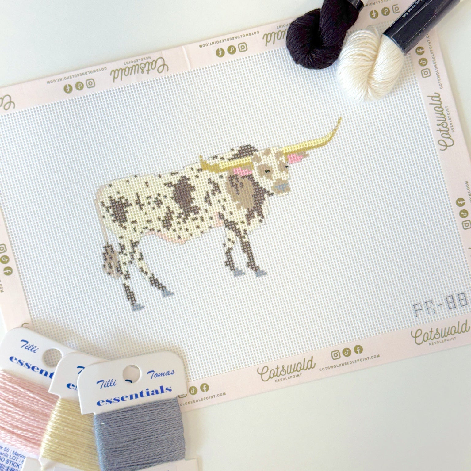 Close-up of Texas longhorn cow needlepoint canvas showing painted 18 mesh details