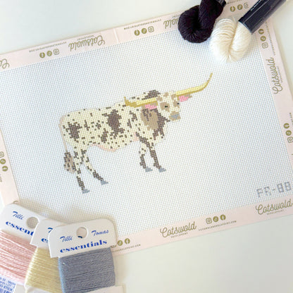 Close-up of Texas longhorn cow needlepoint canvas showing painted 18 mesh details